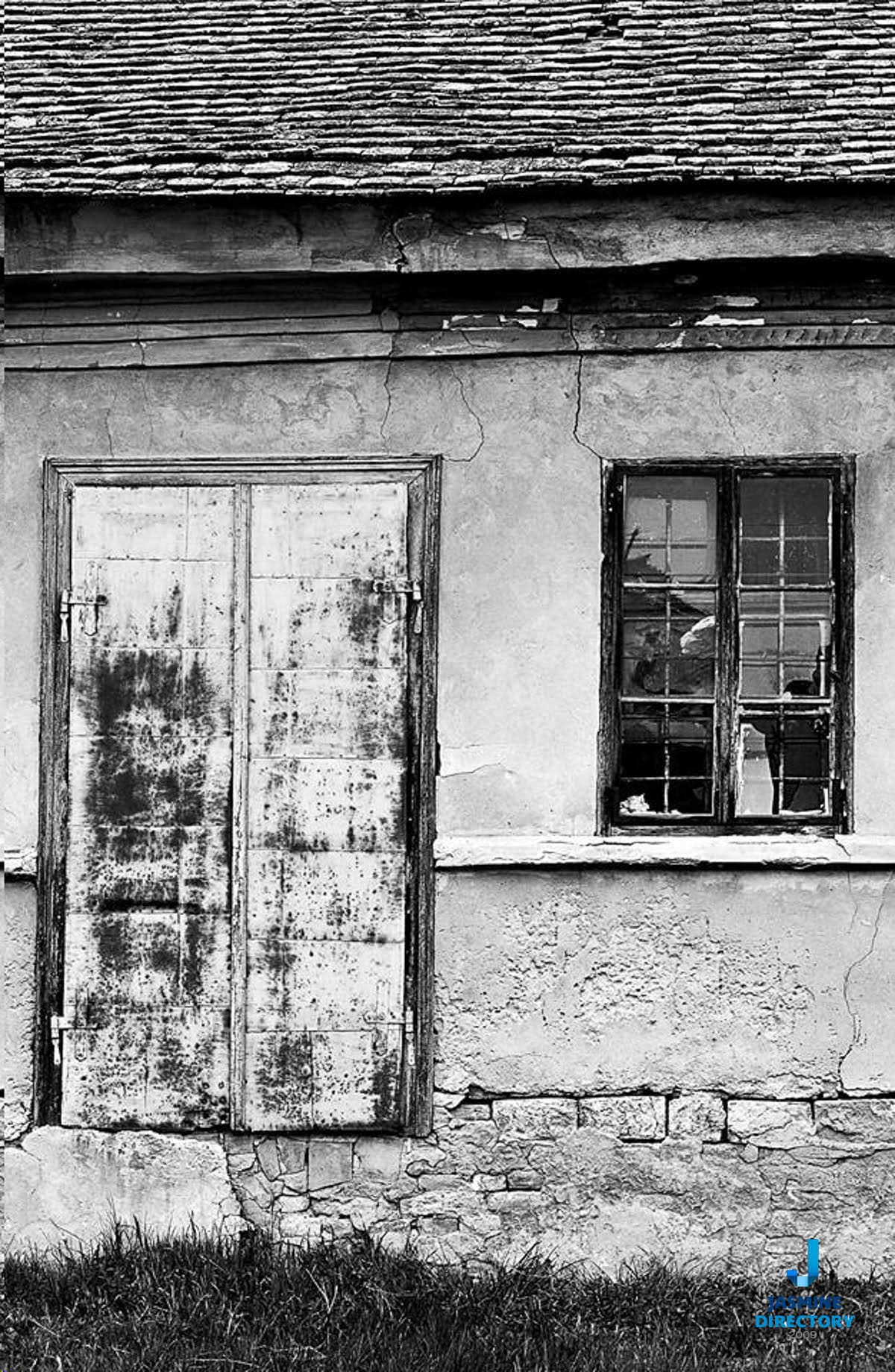 Asymmetrical Balance on an old house with a door and window