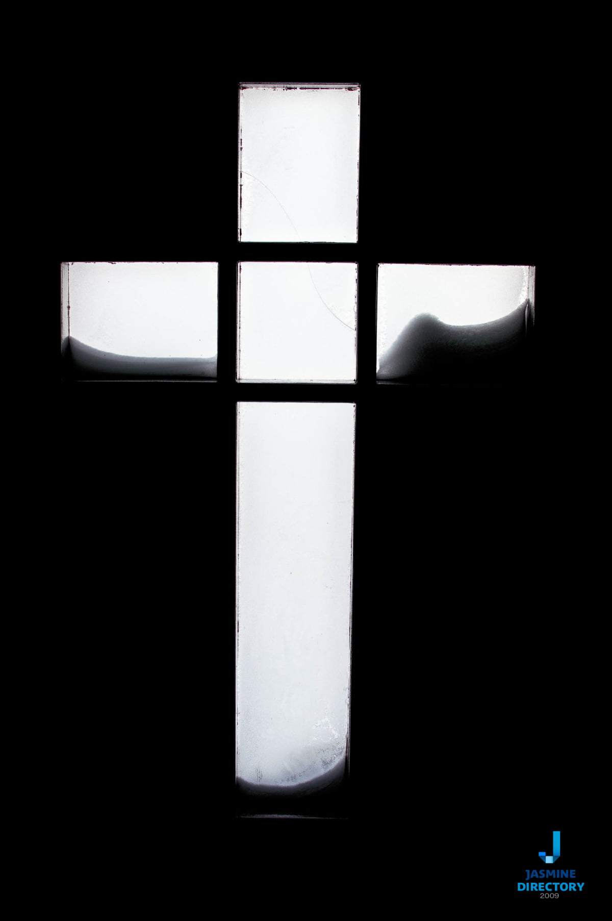 White cross on black background