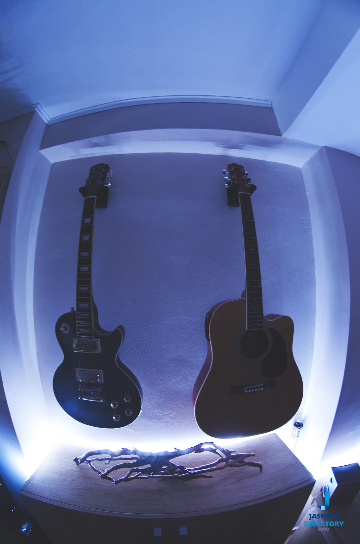 Two guitars forming a simetrical photograph