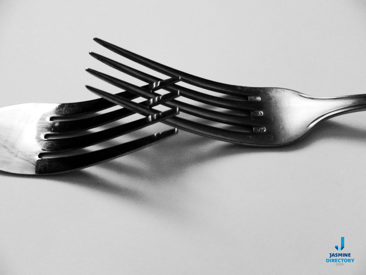 Two forks creating an abstract shape
