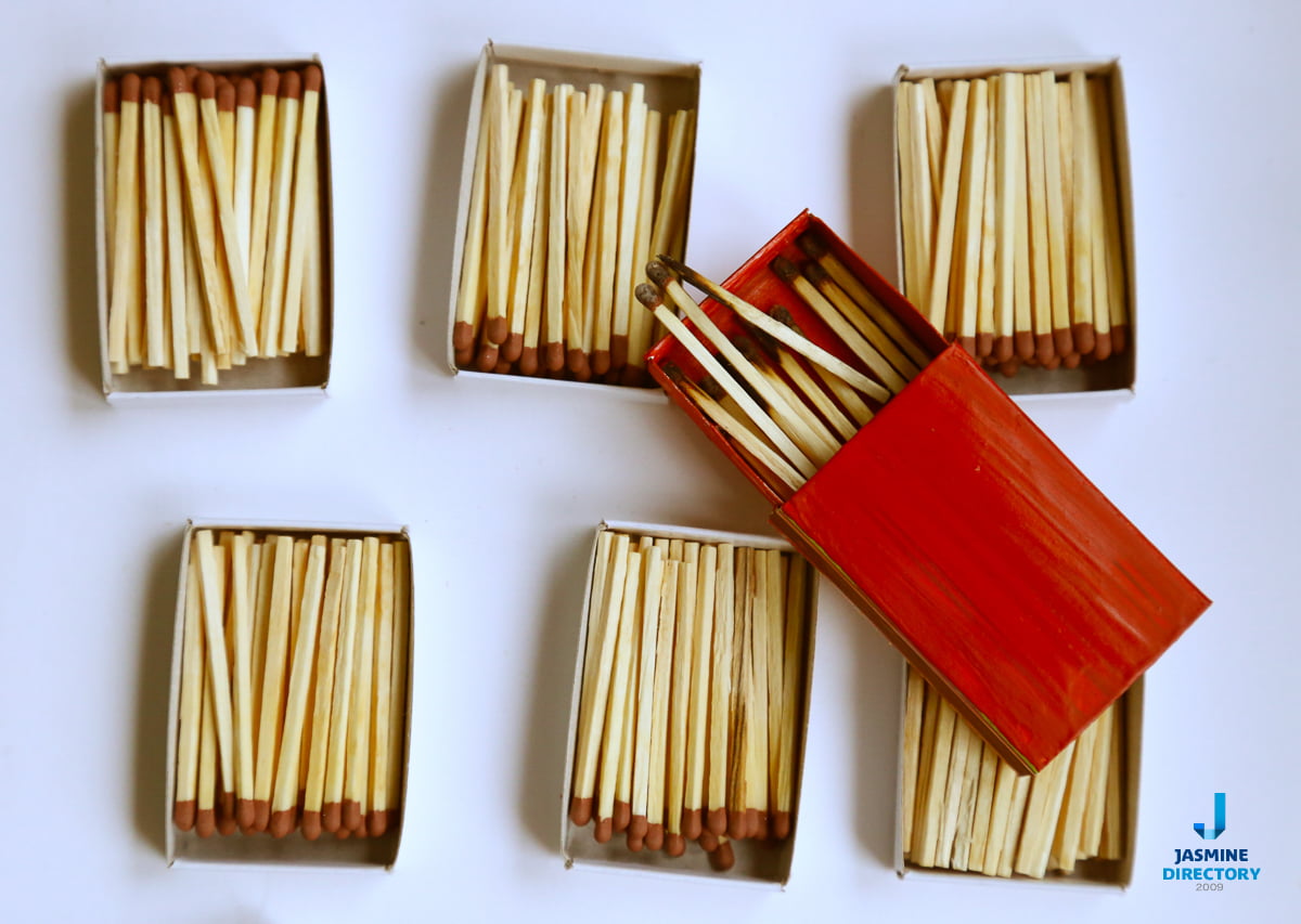 Red unburnt matches on a white background