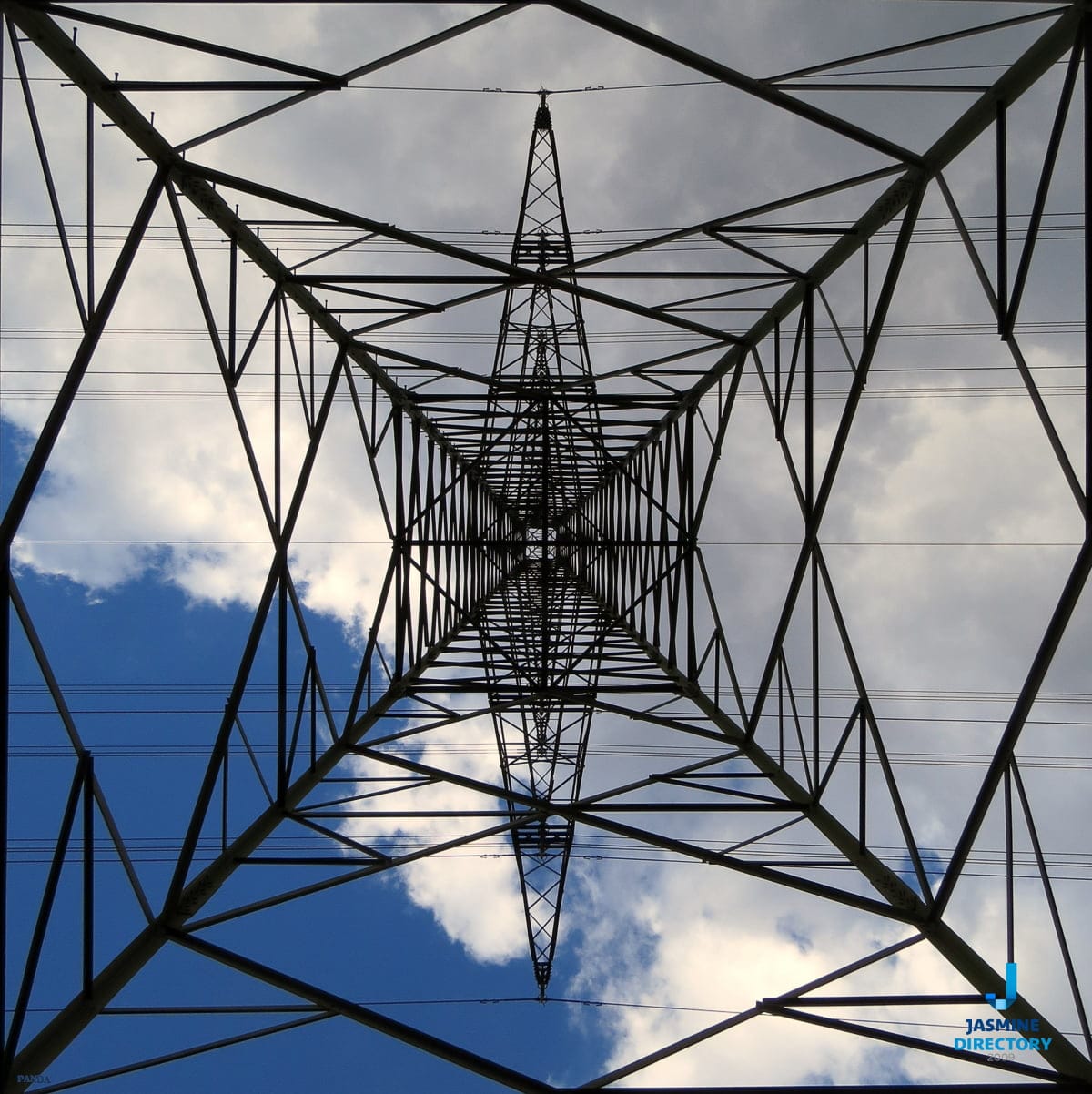 An electricity tower and clouds