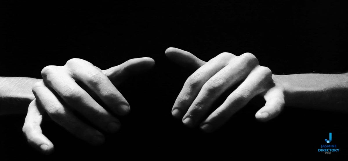 Human hands on black background