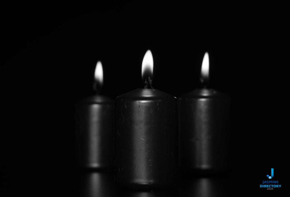 Three candles, white on black