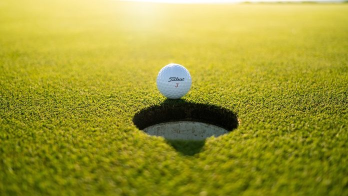 golf ball near hole