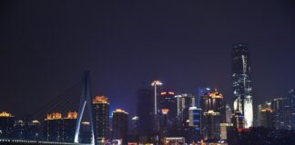 Lighted Buildings Near River at Night