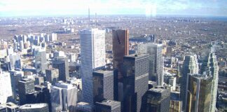 Aerial view of dense downtown skyline with high-rise office towers and glass skyscrapers, illustrating the urban business landscape served by Canadian business directories.