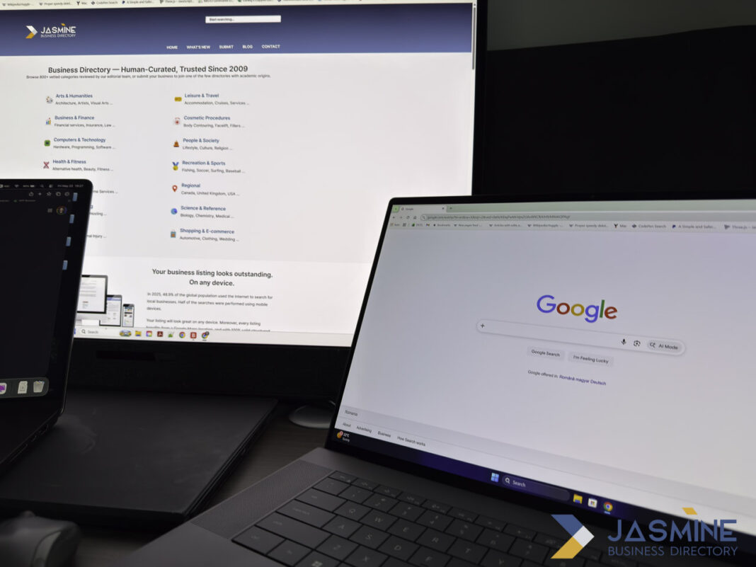 Dual monitor setup displaying different web directory and search interfaces to illustrate directory comparison concepts Two computer monitors display different websites—a business directory with category icons on the left and Google's search homepage on the right—illustrating variations in web directory design and navigation approaches.