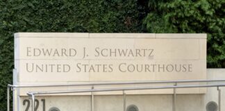 Illinois law firm directory: the 2026 guide Beige limestone facade of the Edward J. Schwartz United States Courthouse with carved lettering and metal railings, representing legal infrastructure for a law firm directory.