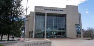 Why Australian law firms need directory listings The High Court of Australia building with its distinctive brutalist glass and concrete facade, representing the professional legal framework relevant to Australian law firm visibility.