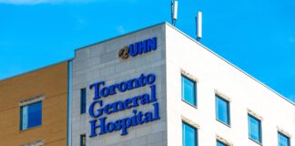 Toronto General Hospital Peter Munk Building exterior with prominent signage and modern facade, demonstrating institutional visibility and professional presence relevant to business directory listings.