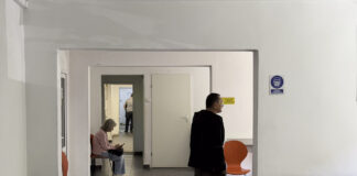 Why orthodontists in Brookhaven recommend early bite evaluations Institutional Waiting Area or Office Corridor