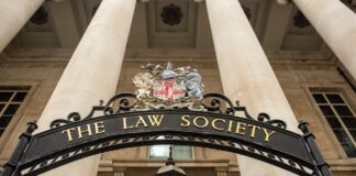 Ornate entrance to The Law Society with classical columns and heraldic signage, representing institutional legal infrastructure featured in the North Carolina law firm directory article.