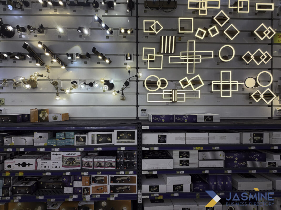 Well-photographed retail lighting showroom demonstrates effective business listing imagery for local commerce. Organized lighting showroom with illuminated track lights and LED fixtures on wall displays, exemplifying professional business listing photography for retail establishments.