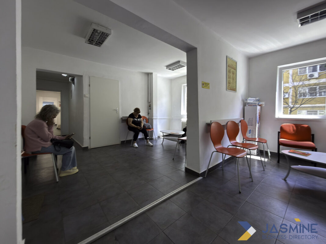 Professional medical waiting room environment illustrating healthcare facility infrastructure for physician directory services Modern medical office waiting area with orange chairs and patients seated, representing the professional healthcare environments featured in physician directory listings.