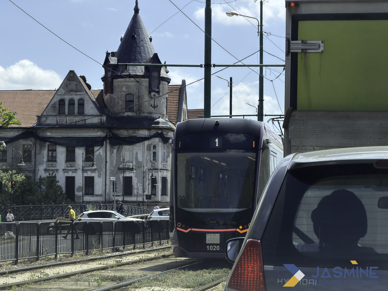 Modern tram and historic architecture