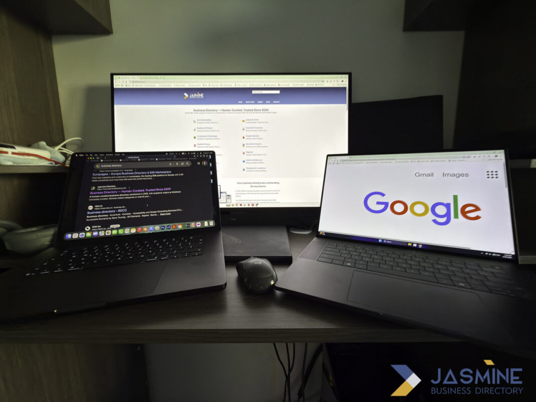 Multi-screen desktop setup illustrates digital research workflows used by North Dakota firms accessing legal directories Three glowing computer screens on a wooden desk at night showing business directory websites, illustrating how professionals research and access legal services online.
