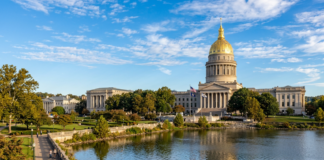 The best law firm directory for South Carolina firms Neoclassical capitol building with golden dome beside a river, representing governmental authority and legal infrastructure for South Carolina law firm directories.