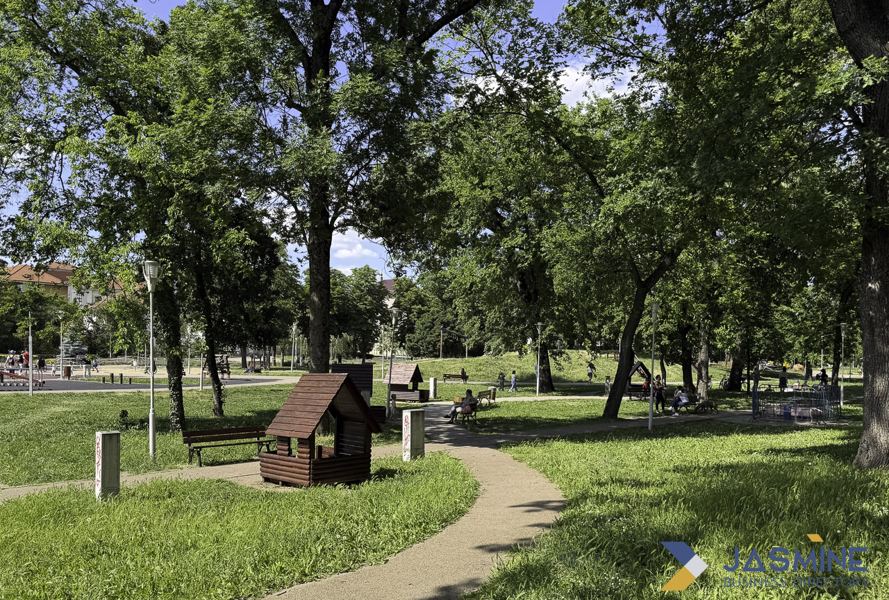 Public park with walking path and decorative structure