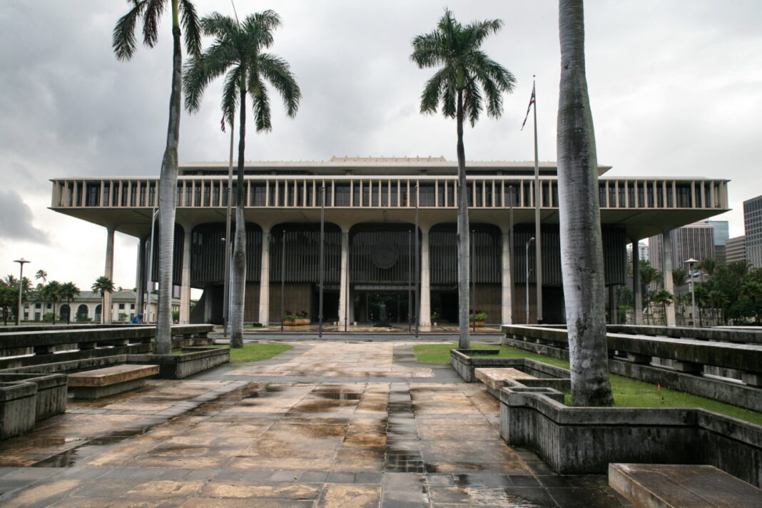Hawaii State Capitol building exterior represents the institutional backdrop for law firm directory listings across the state. Modern Hawaii State Capitol building with palm-lined plaza under overcast skies, representing the institutional framework for law firm online directory listings.