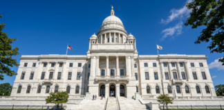 The Rhode Island State House with its distinctive white dome and columned facade symbolizes the state's legal system and framework for legal professional directories.