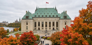Top legal directories for Canadian lawyers in 2026 Supreme Court of Canada building with curved pathway and autumn trees, representing the Canadian legal profession and institutional authority for legal directories.