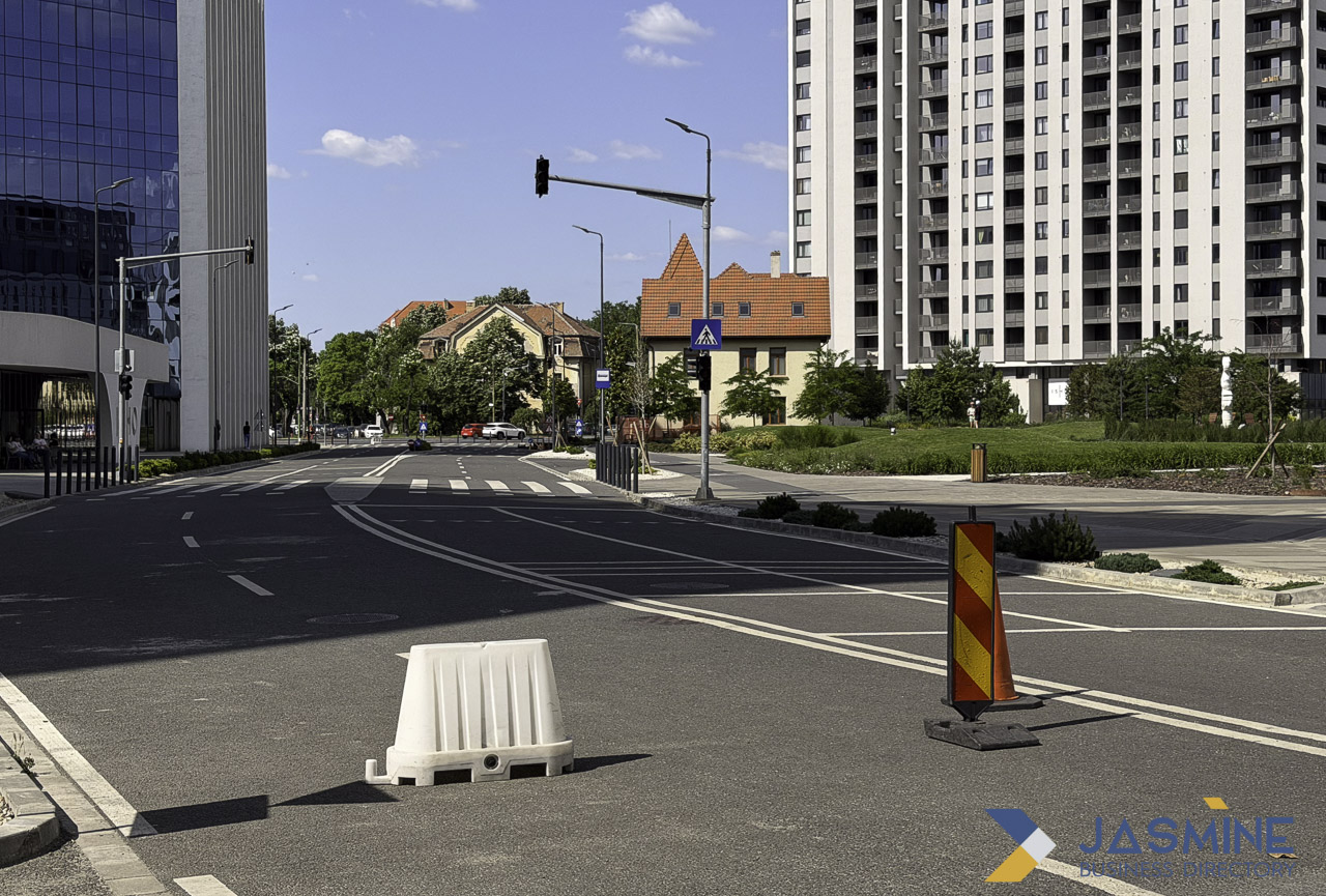 Urban street intersection with modern development