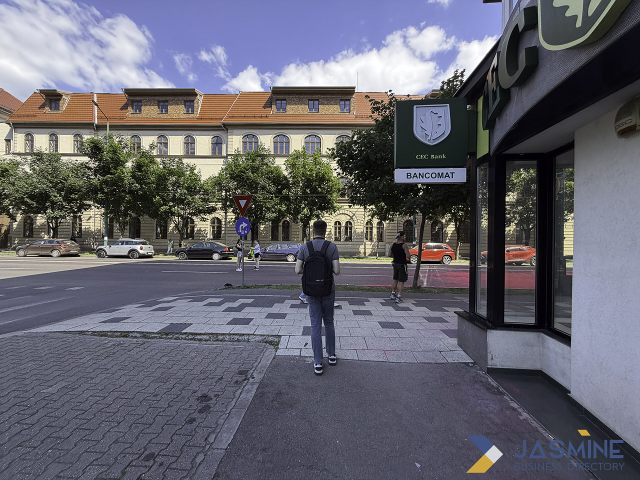 Urban street scene with bank ATM kiosk