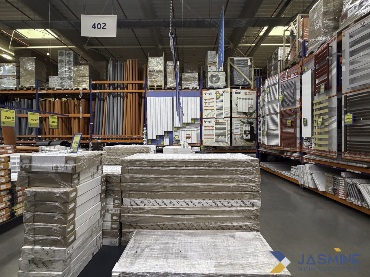Warehouse aisle with building materials and radiators