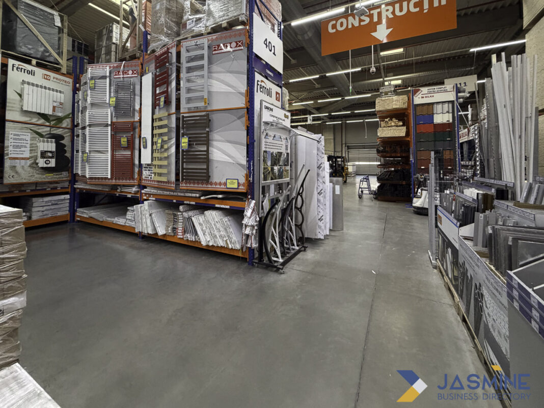 Organized warehouse retail interior exemplifies complete business listing infrastructure and product presentation Warehouse store interior with organized shelving displaying construction products and directional signage, illustrating the physical infrastructure that supports complete business listing information.