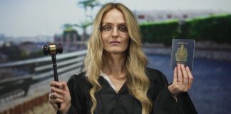 Woman in professional attire holds a gavel and Canadian passport, symbolizing legal services and professional accessibility for Canadian lawyer directories.