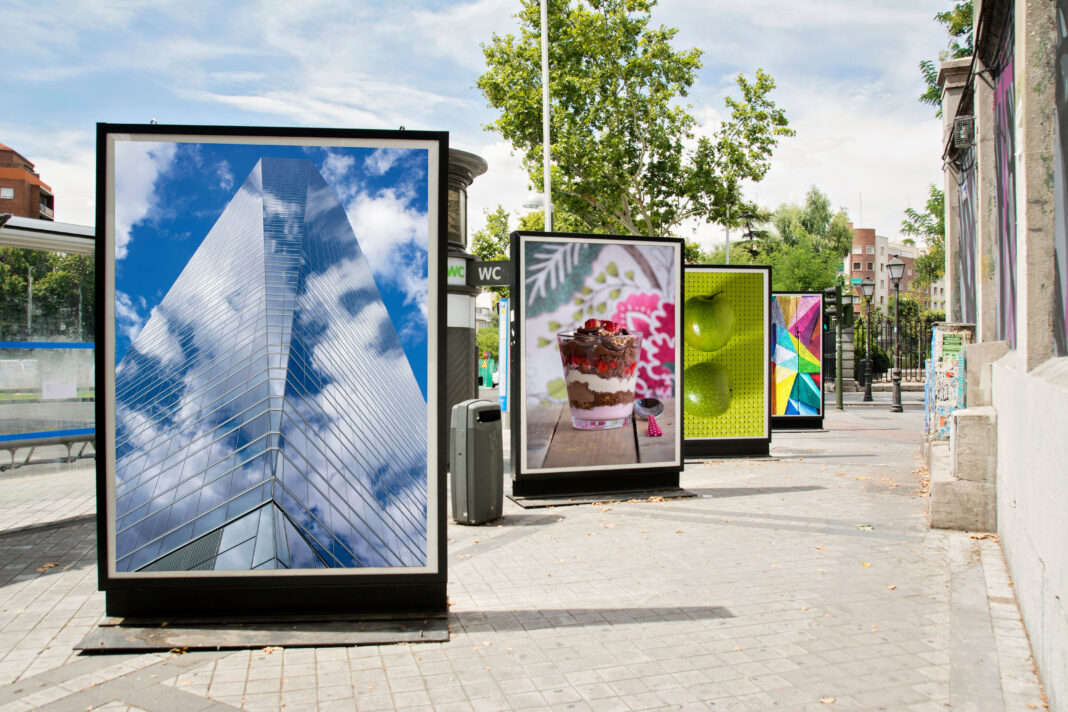 billboards with photographs at city street