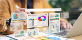 The Data Dividend: How to Package and Sell Market Reports from Your Directory Laptop and floating transparent panels display colorful pie charts and bar graphs in a professional workspace, illustrating the transformation of directory data into marketable intelligence reports.