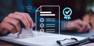 What Makes an EdTech Software Development Company Reliable? Hand holding rubber stamp over clipboard with documents and digital overlay showing checkmarks and certification symbols, representing the business directory verification process.
