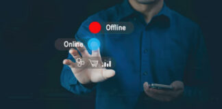 The Rise of “Utility Advertising”: Creating Ads That Solve Problems Business person in blue shirt gestures while holding smartphone with digital overlay showing online and offline status indicators, representing utility advertising that provides practical solutions.
