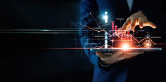 The Secret Power of Business Listings Business professional holding transparent tablet with glowing holographic interface showing charts and data, illustrating digital tools that enhance business discoverability and market presence.