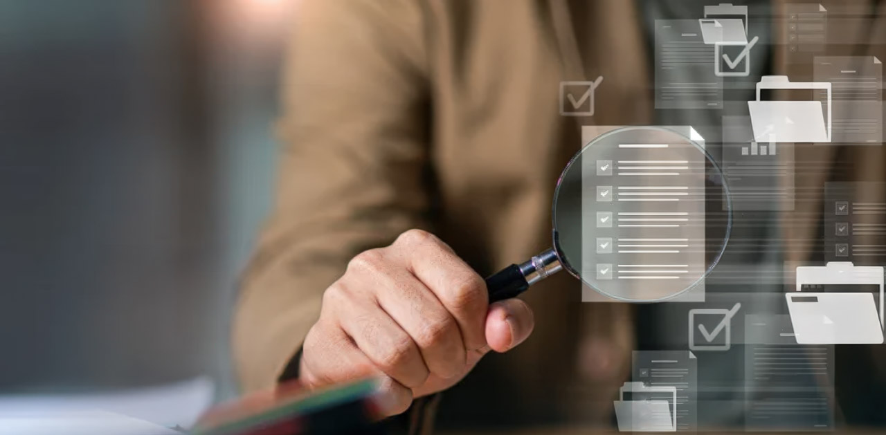 Business professional holding magnifying glass with digital checklist overlay graphics, representing meticulous review for business directory listing audits and accuracy verification.