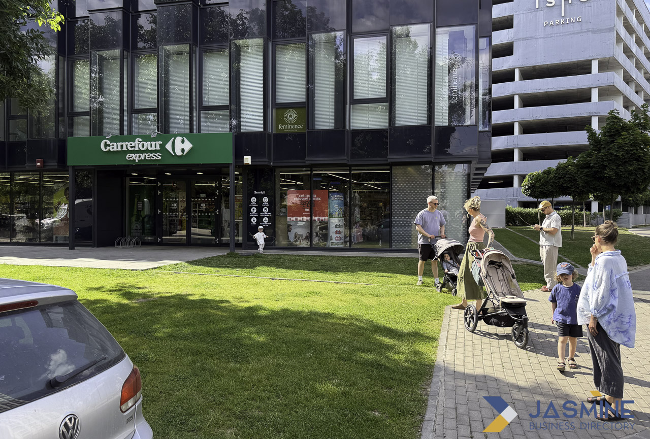 Pedestrians with strollers pass a modern Carrefour Express storefront with prominent signage, illustrating how effective retail signs attract customers in urban settings.