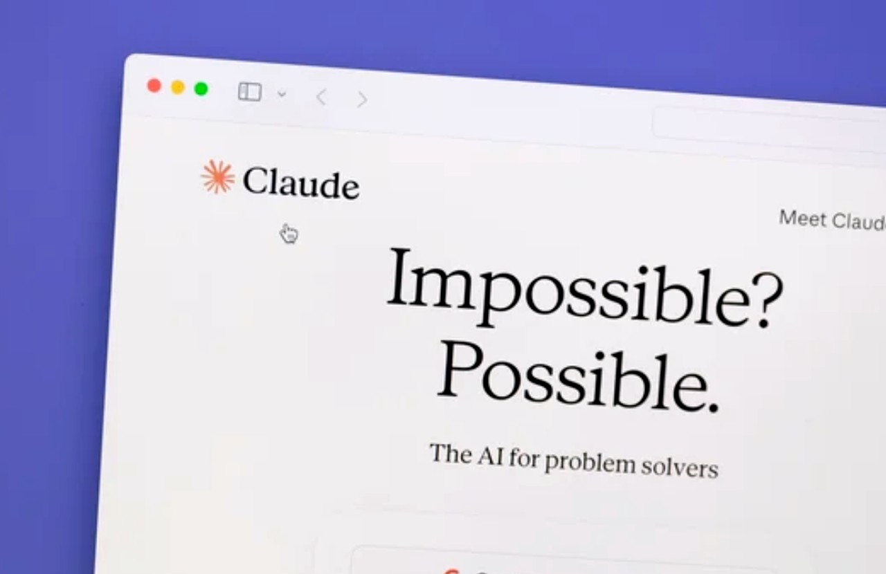 Computer screen showing Claude AI landing page with orange starburst logo and headline 'Impossible? Possible.', representing AI tools used for on-page SEO optimization.
