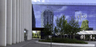 Top 7 Revenue Based Financing Firms in 2026 Modern urban plaza with raised tree planters and contemporary glass buildings, illustrating effective integration of architecture and landscape design in modern properties.