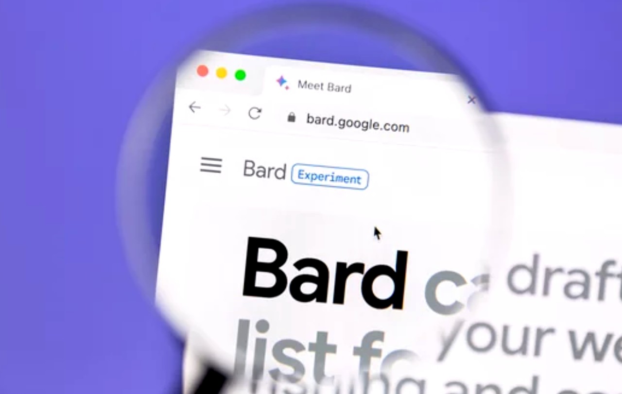 Close-up of Google Bard website displayed through a magnifying glass against a purple background, illustrating AI-powered search tools changing information discovery.
