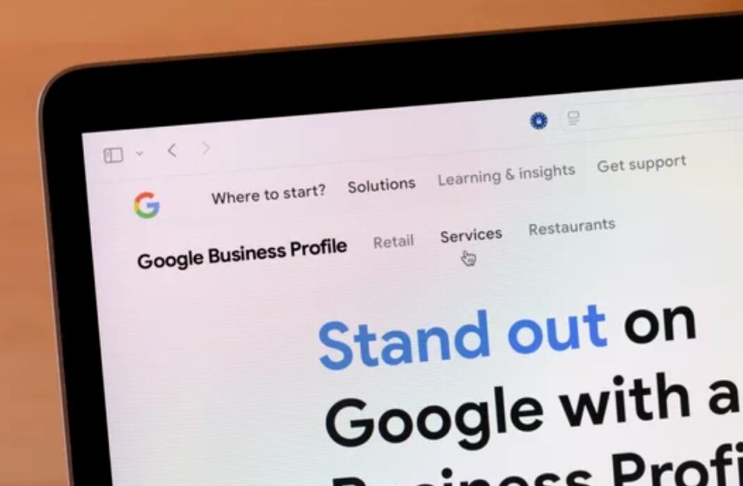 Google Business Profile interface demonstrating online business visibility tools for local bar directories and SEO optimization. Laptop displaying Google Business Profile webpage with navigation menu and marketing text, illustrating digital tools for optimizing local bar business directory visibility and search rankings.