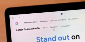 Local Bar Business Directories: Hidden SEO Boost Laptop displaying Google Business Profile webpage with navigation menu and marketing text, illustrating digital tools for optimizing local bar business directory visibility and search rankings.