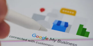 Defining Citation Authority for Modern Business Listings White stylus pen near Google My Business interface showing storefront icon and rating symbols, representing digital tools for managing business listing citation authority and verification.