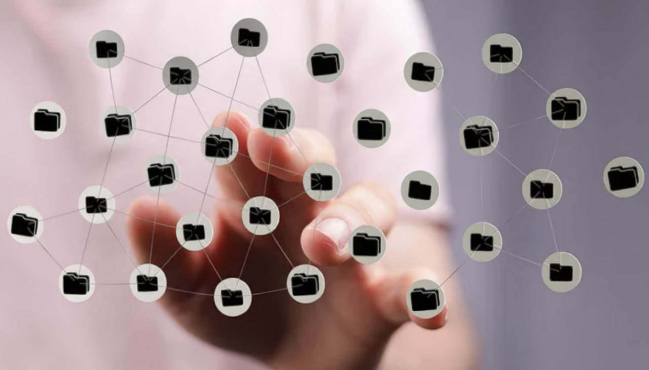 Blurred hand reaching forward with overlay of interconnected folder icons and network lines, representing directory-based navigation and linking systems.