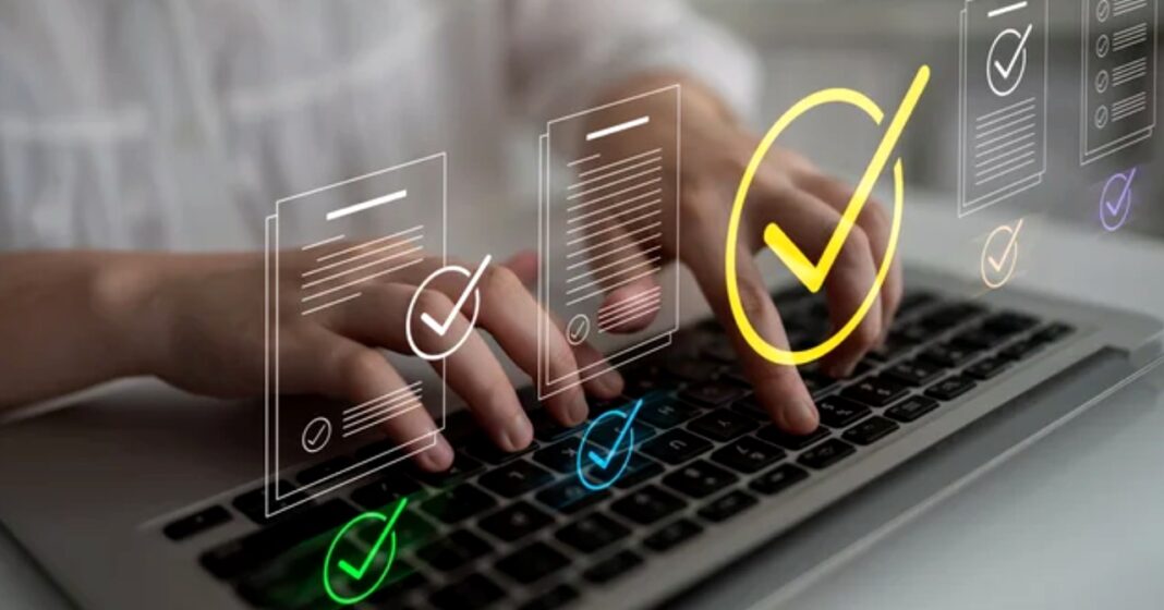 User editing and updating online directory listing information through digital interface Hands typing on laptop keyboard with digital checkmark and document icons overlaid, illustrating the process of editing online business directory listings.