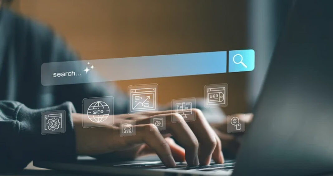Digital overlay interface illustrates search engine optimization and web rendering processes Hands typing on laptop keyboard with translucent digital overlay showing search bar and SEO icons, illustrating web rendering and search optimization concepts.