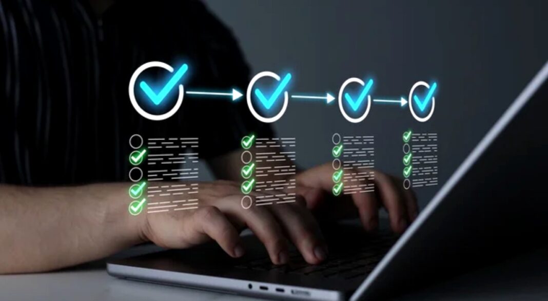Laptop user working with digital workflow visualization illustrating directory submission automation processes Hands typing on laptop keyboard with glowing cyan workflow graphics overlay showing checkmarks and checklists, representing automated directory submission processes.