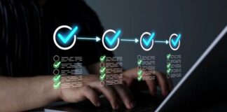 How to automate directory submissions? Hands typing on laptop keyboard with glowing cyan workflow graphics overlay showing checkmarks and checklists, representing automated directory submission processes.