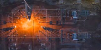 A Practical Compliance Calendar for Companies Operating Across Multiple States Aerial view of an industrial facility with orange flare stack overlaid with blue technical wireframe diagrams, illustrating modern electrical engineering and infrastructure monitoring systems.